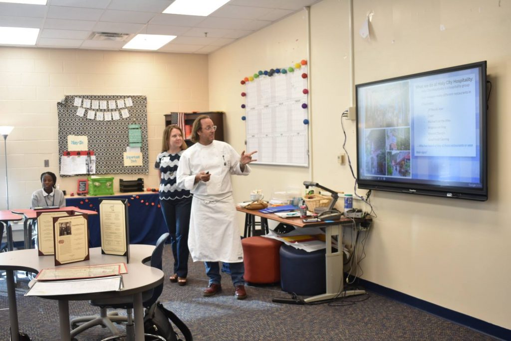 Chef Richard Farr covering Holy City Hospitality's role in the community at Burke High School